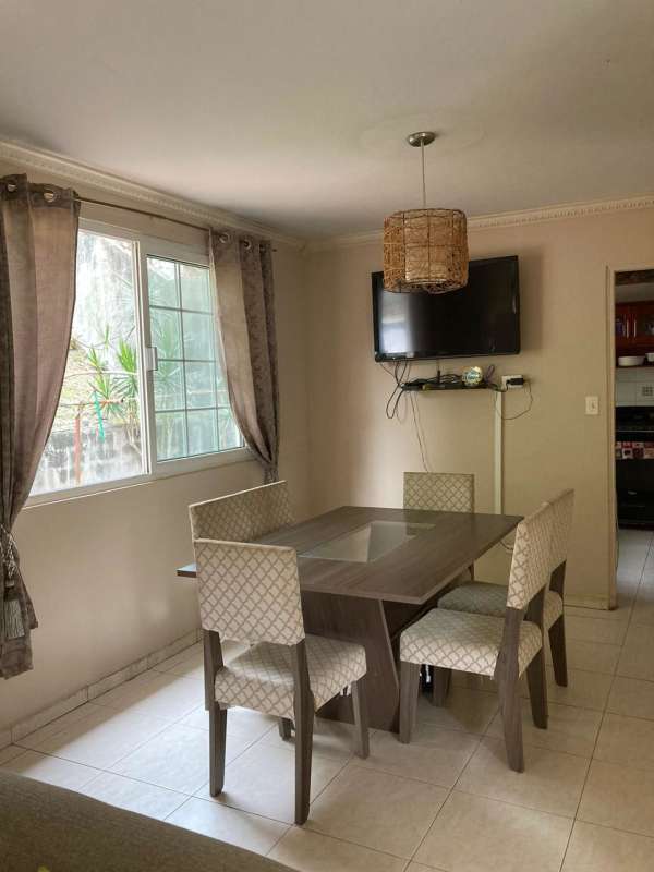 Bathroom with ceramic tile walls and glass divider in duplex Riviera Colonial Panama