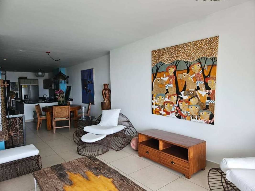 Covered balcony with wooden furniture and Pacific Ocean view Avenida Balboa PH Rivage Tower