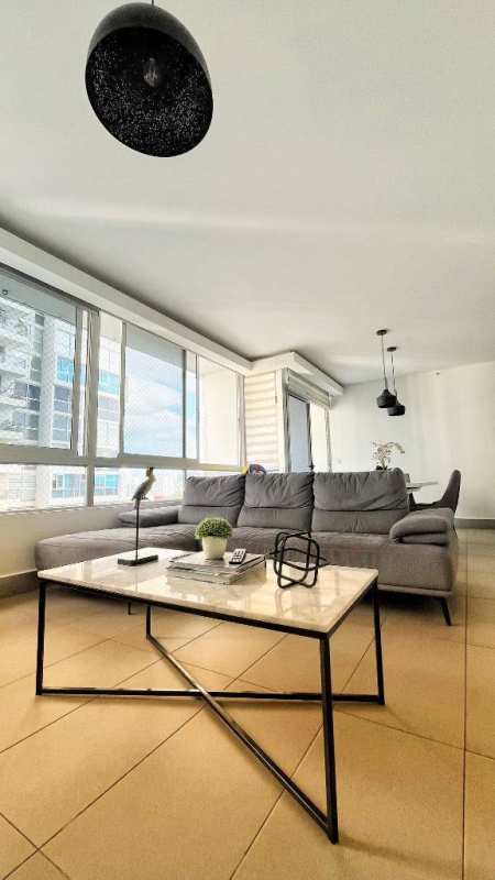 Colorful indoor children's play zone with slide, padded climbing area at PH La Loma Panama