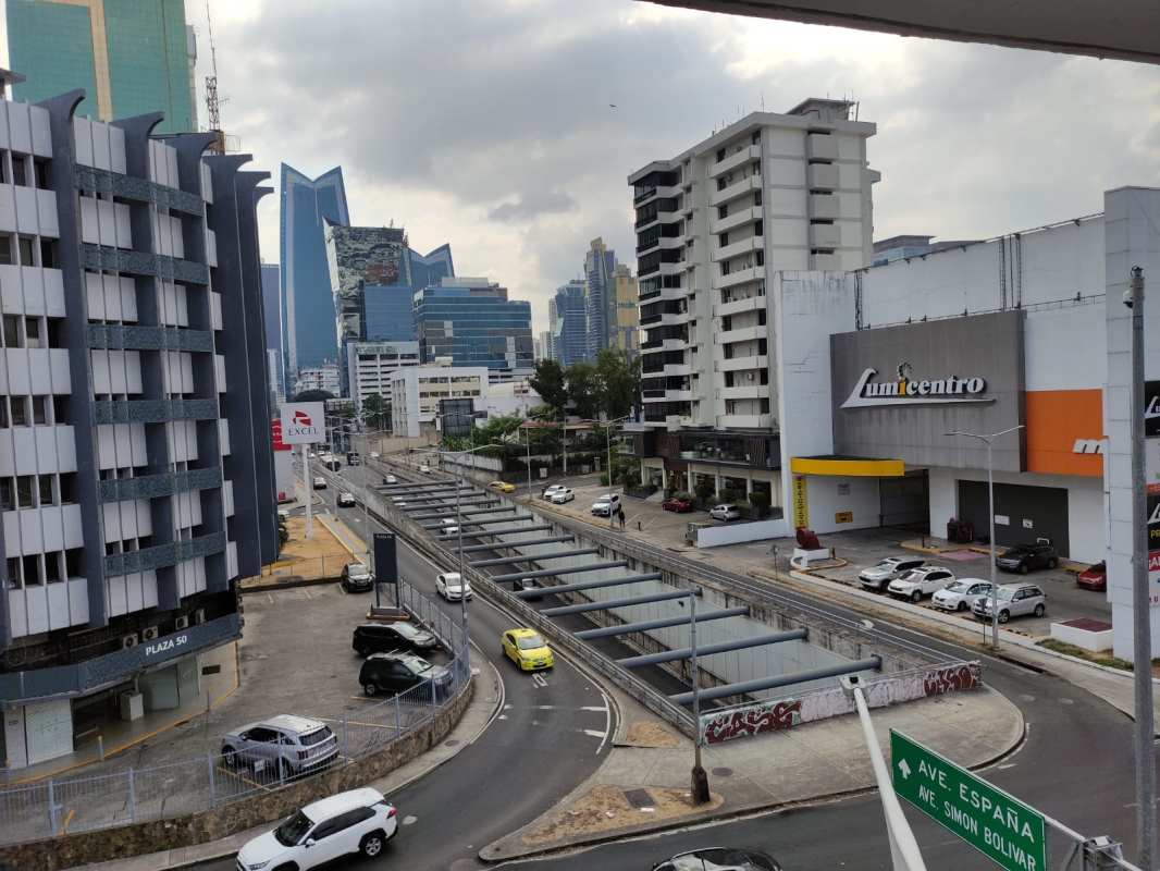 Living room with access to balcony overlooking city skyline in Marvel Tower, Panama