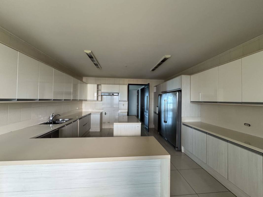 Spacious modern kitchen with beige cabinetry and island PH Torre Zeus Costa del Este Panama