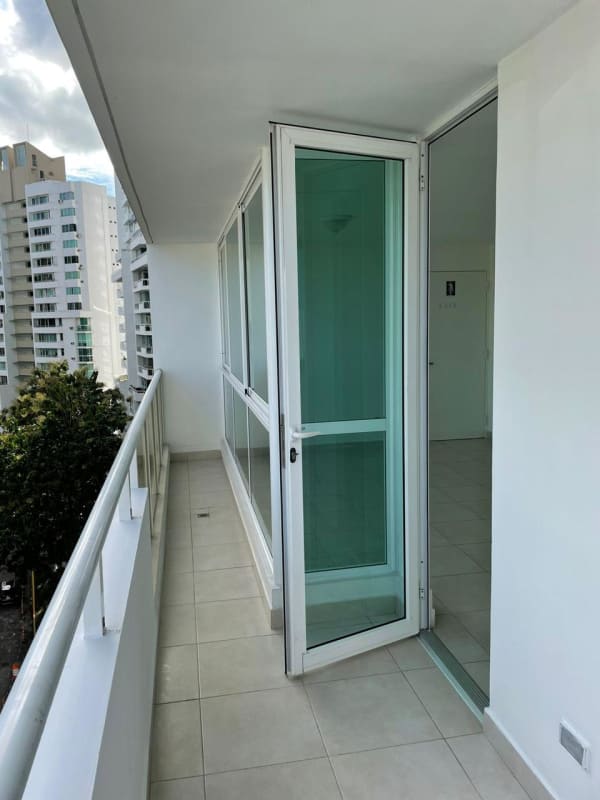 Kitchen with granite counters, wood cabinets, gas stove in PH El Mare 700 Edison Park Panama City Panama