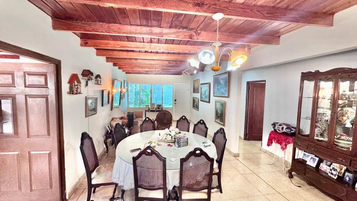 Spacious living room with wood beam ceiling and tiled floors in Altos de Betania Panama