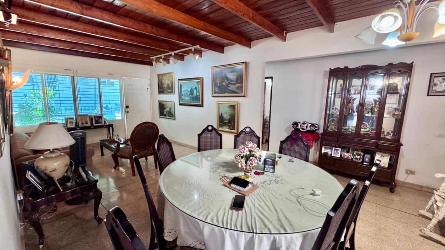 Bathroom with retro mint green tiles and shower enclosure in Betania Panama house