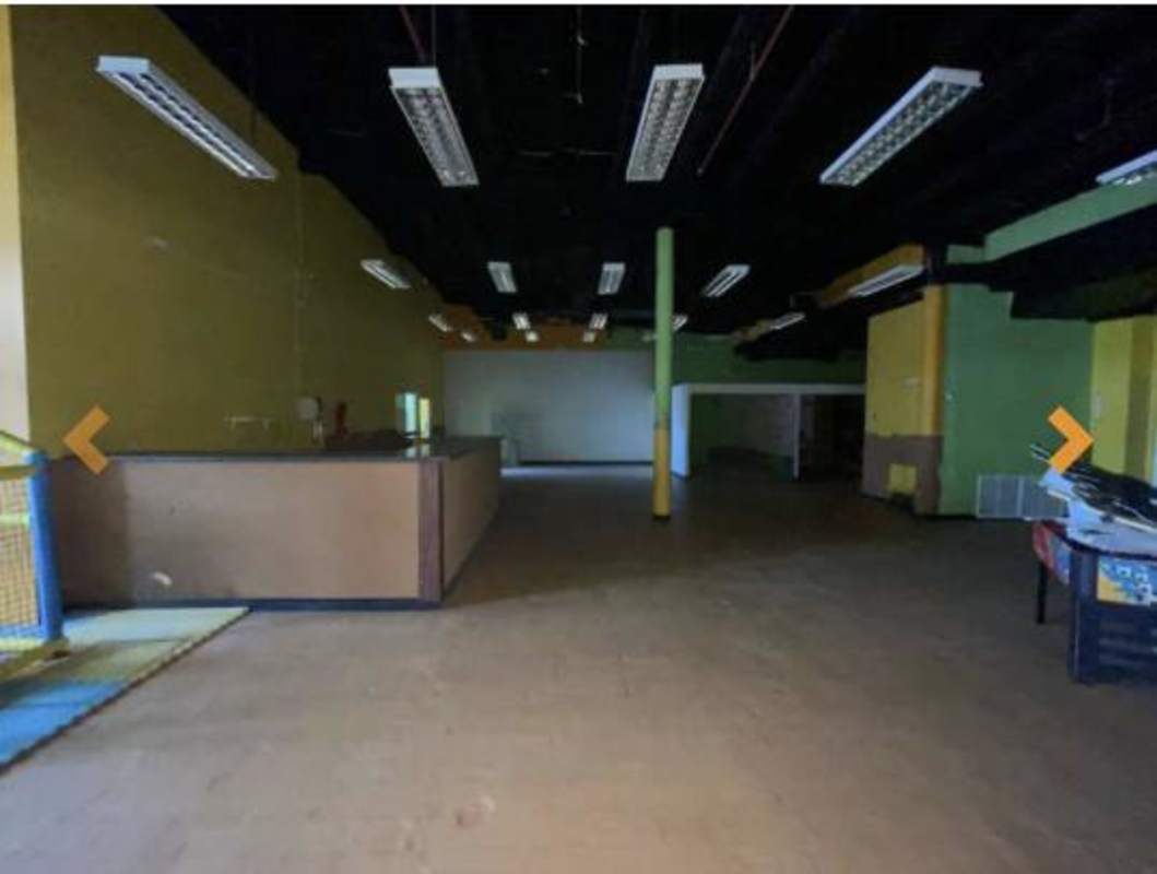 Open plan retail commercial interior with partitions bright lighting Panama City
