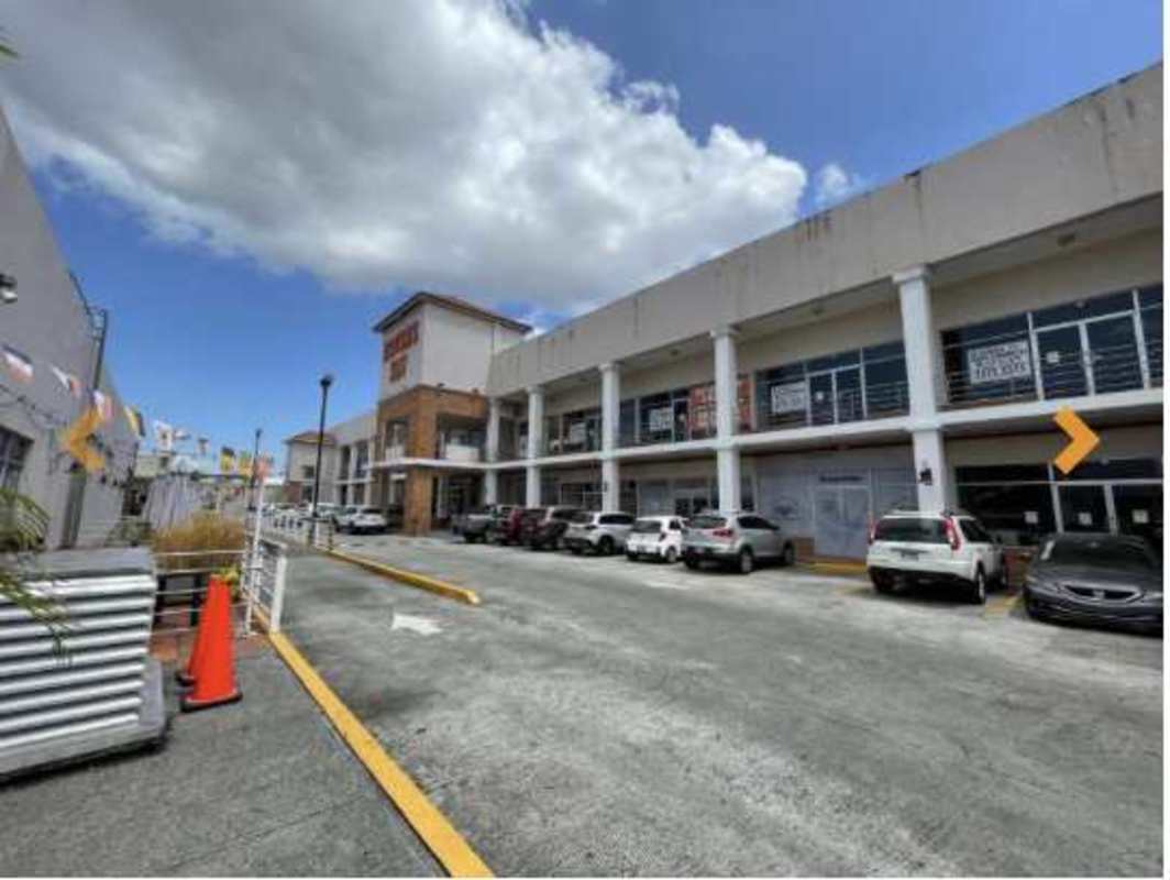 Two story plaza facade glass storefront parking lot Brisas del Golf Panama City