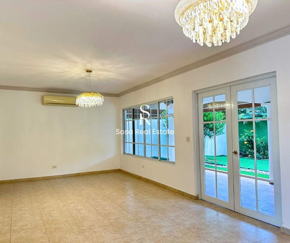 Spacious living room with French doors to garden Costa del Este Panama rental house