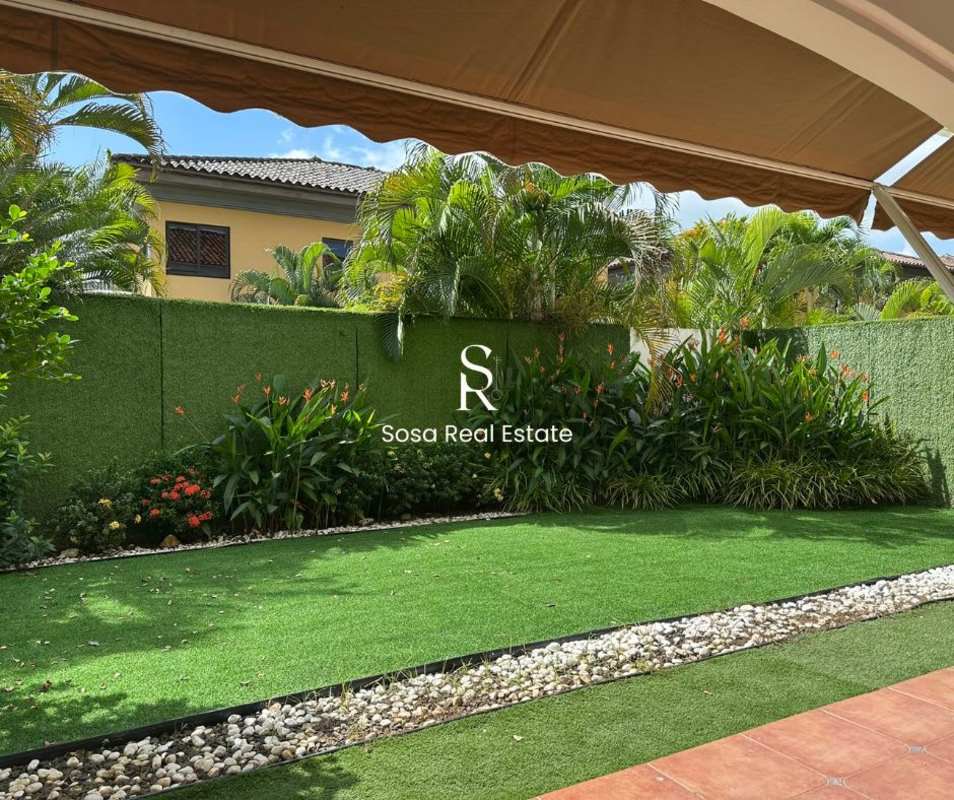 Covered terrace with artificial lawn and tropical plants Costa del Este Panama