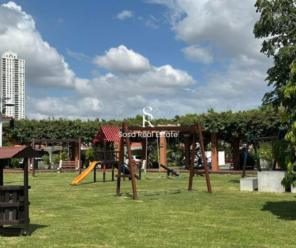 Children's playground area with green lawn at Costa del Este Panama gated neighborhood