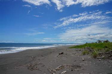 Wide sandy beach with Pacific Ocean waves steps from Las Olas Resort land for sale