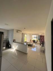 Open floor plan with bright kitchen, living and dining area in PH Jardines Espino Santiago Panama