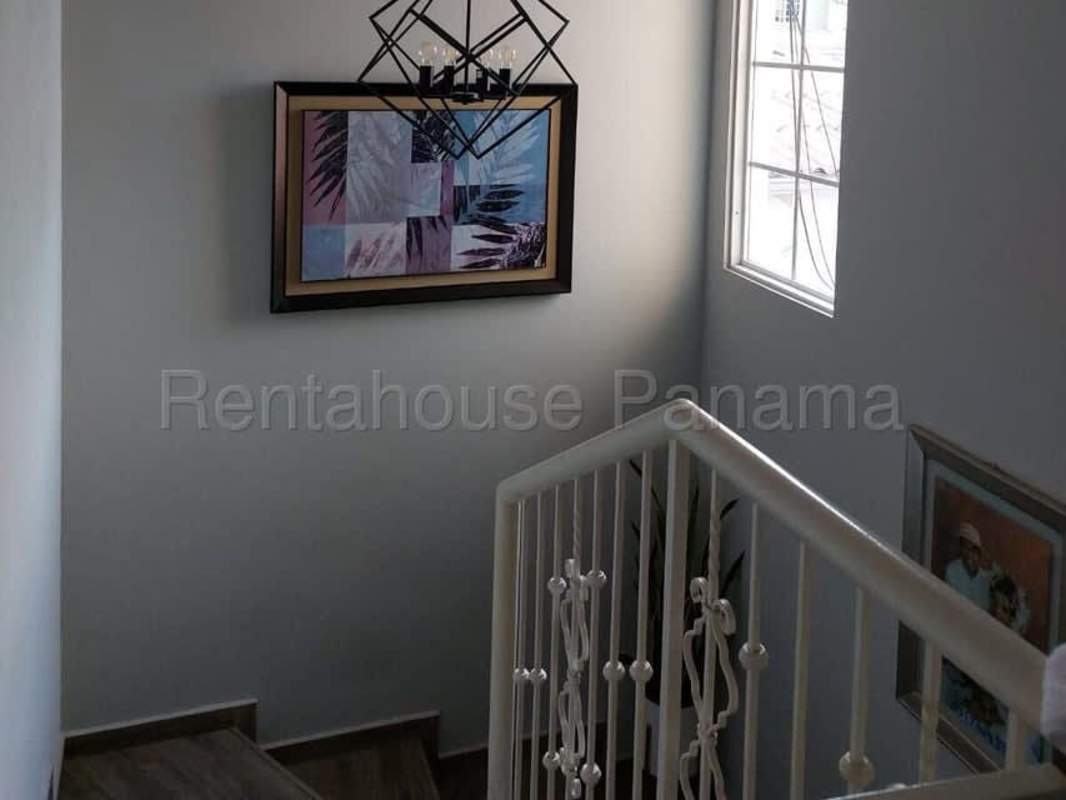 Modern kitchen with granite countertops and wood cabinetry in PH Paseo Real Villa Lucre Panama