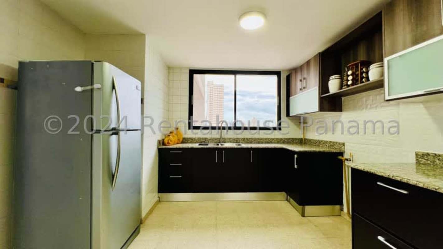 Modern kitchen with granite countertops large window city views PH Cancun Obarrio Panama