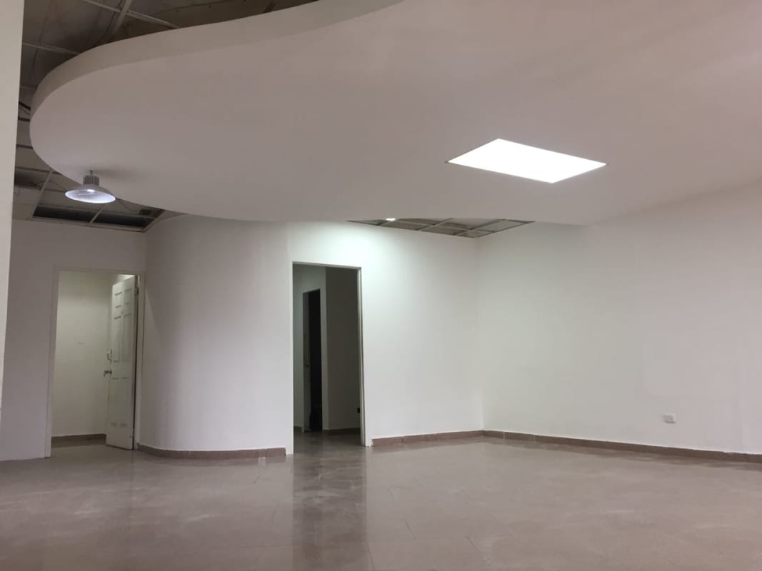 Empty interior space with exposed ceiling grid and tile flooring inside PH Kitaen Panama