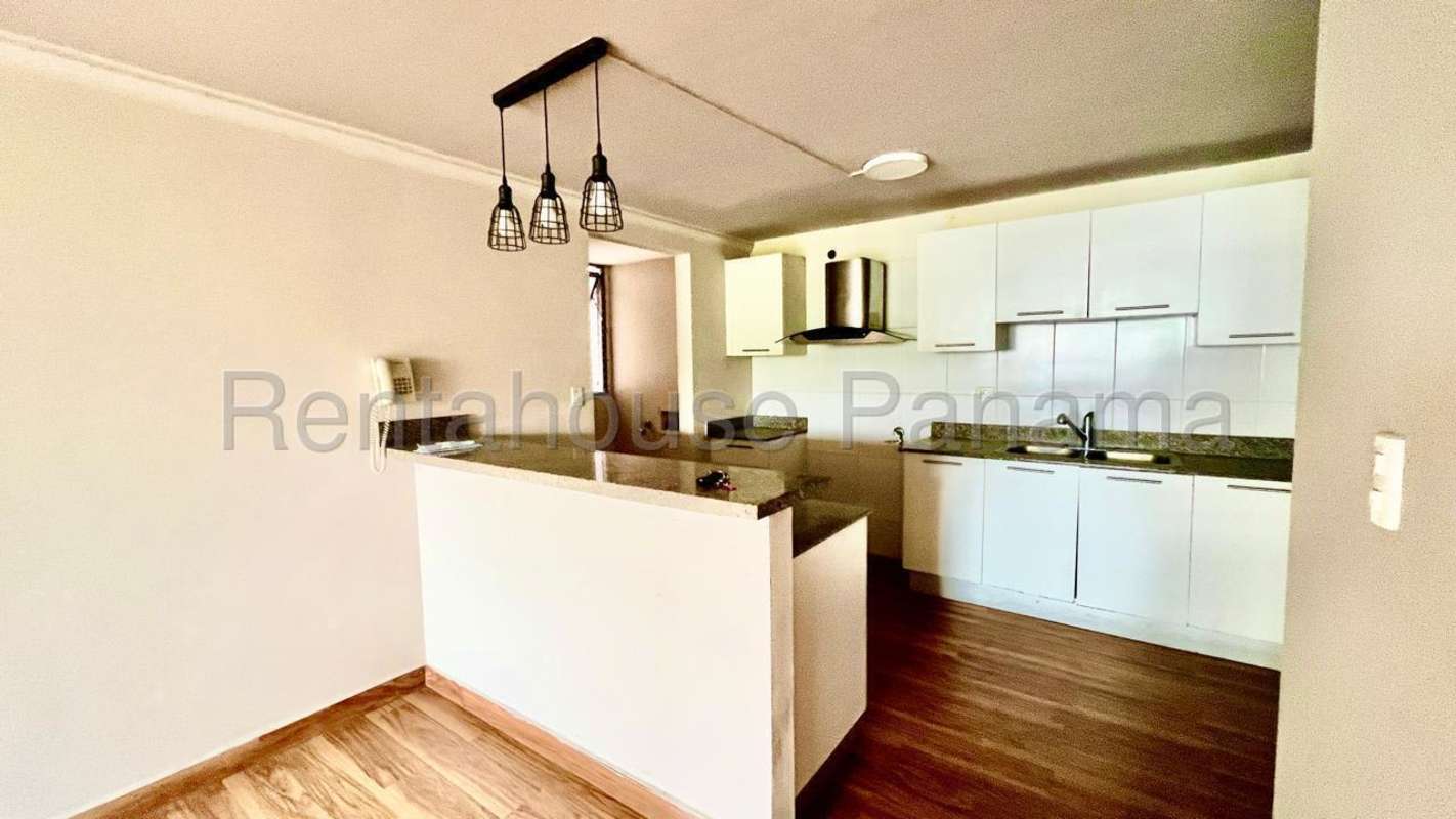 Bright living room with large windows overlooking Condado del Rey Panama