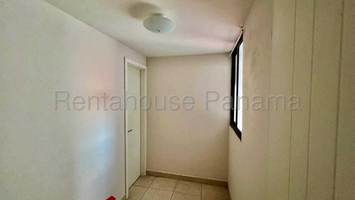Modern kitchen with granite countertop and breakfast bar at PH Condado Gardens Panama City