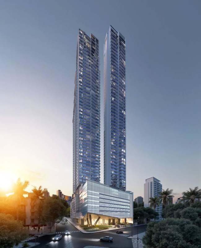 Modern twin skyscrapers with sunset backdrop at PH La Costanera Panama City