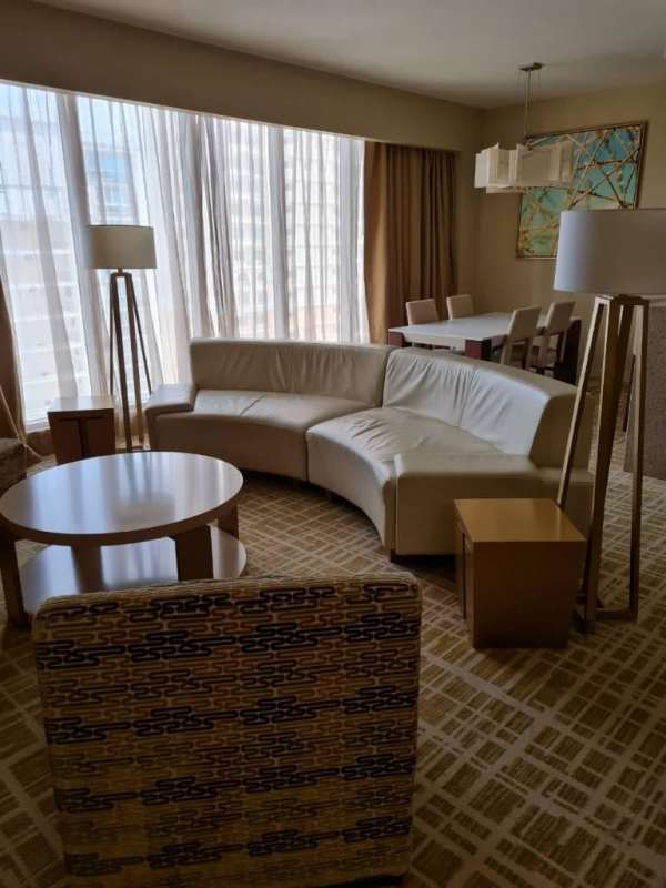 Luxury master bedroom with wall TV and large windows for rent in Panamera Residences Panama