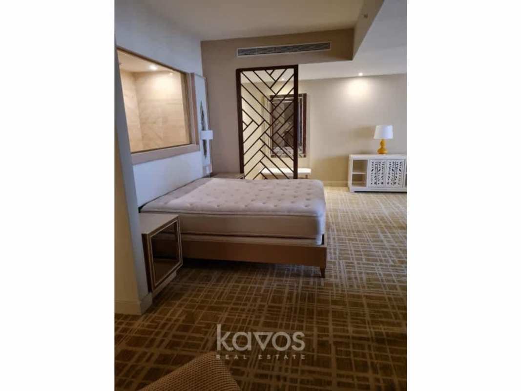 Bedroom suite with contemporary design wood partitions in Panama hotel residence