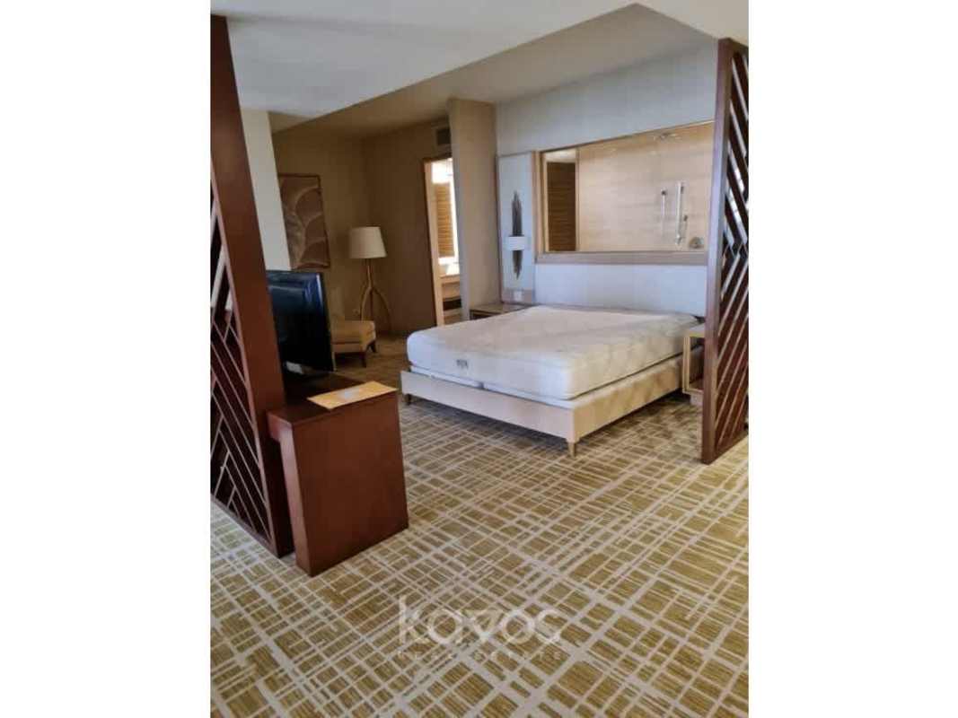 Luxury bedroom flat-screen TV large window hotel Waldorf Astoria Panama City