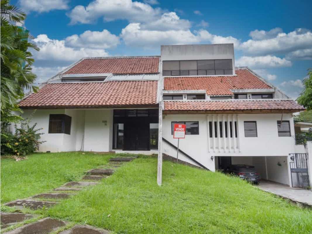 Exterior of house for sale with red tiled roof and garage in Coco del Mar Panama City