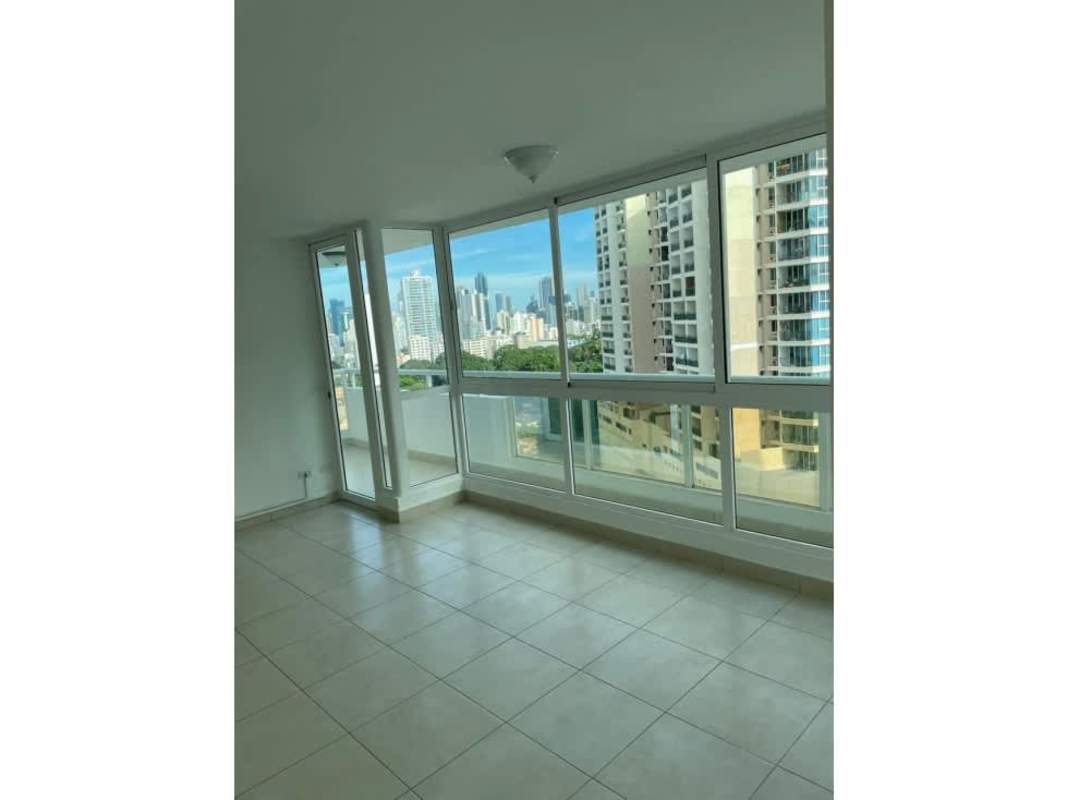 Bright living room with large windows, balcony view, ceramic tile floor at PH El Mare 700 Panama City