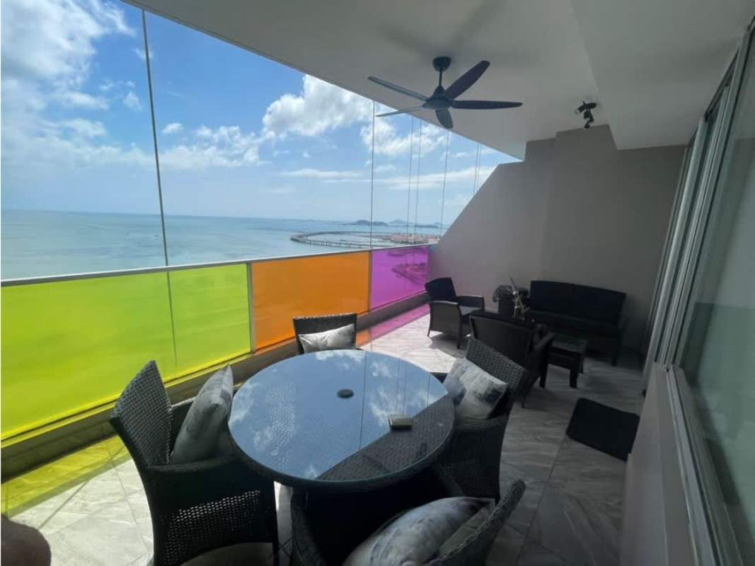Living and dining room with large windows and ocean views PH Element Panama
