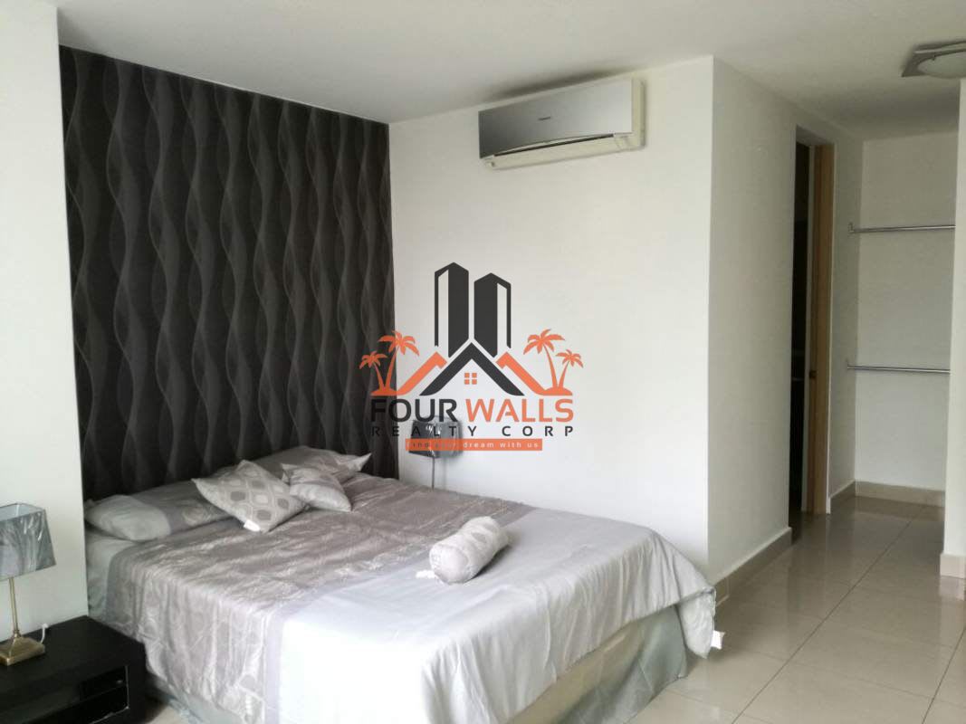 Contemporary lobby with colorful seating, large windows, and accent wall in PH Citrus San Francisco