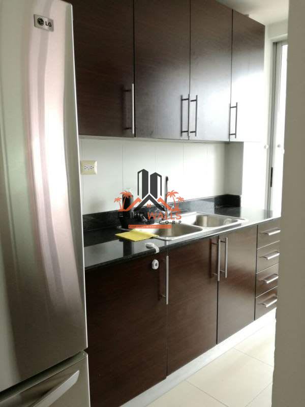 Bedroom featuring accent wallpaper, split-type AC, open closet PH Citrus San Francisco