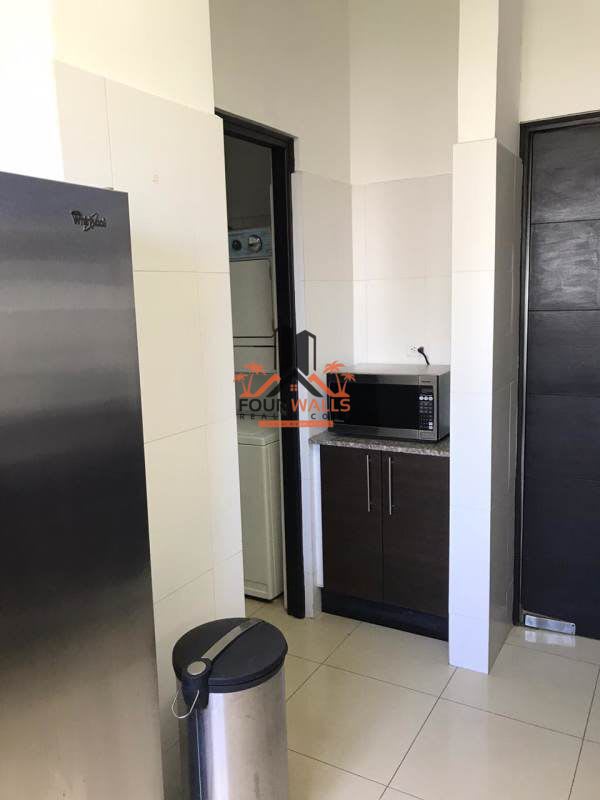 Spacious living room tiled floor balcony access Obarrio Panama