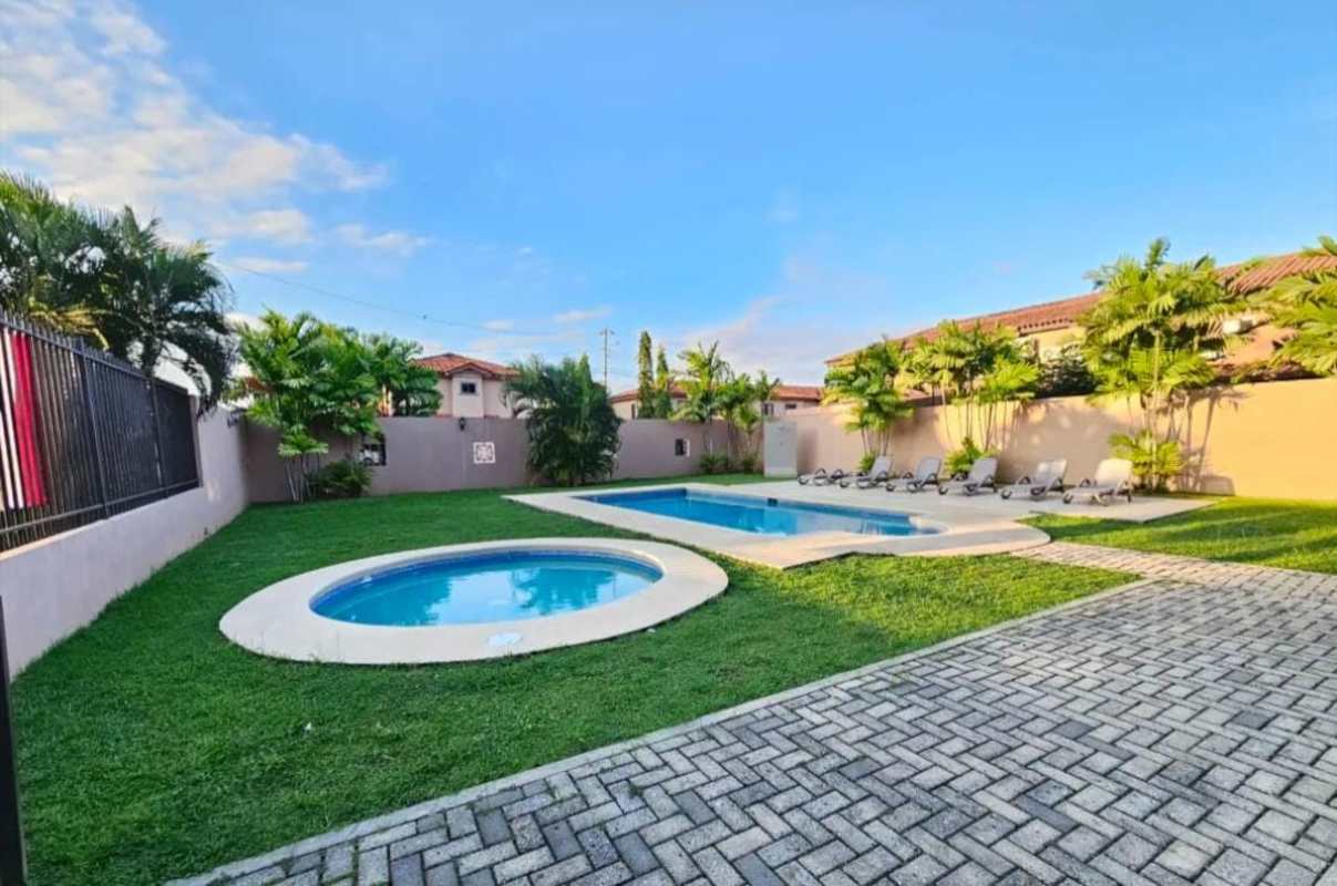 Outdoor adult and children pool with sun decks green gardens in Versalles Ciudad Radial Panama