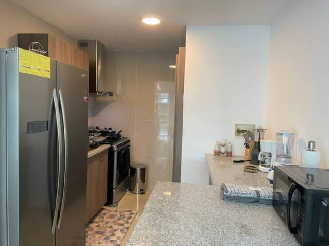 Private balcony with glass railing, panoramic ocean and skyline view in PH GV43 Panama City