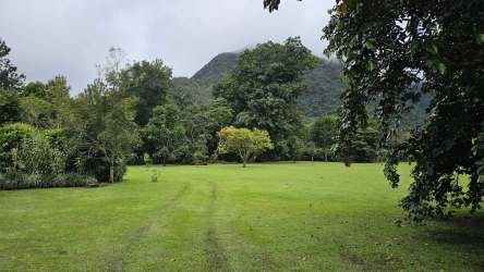 Flat open grassy lot with distant mountain view in El Valle Anton Panama