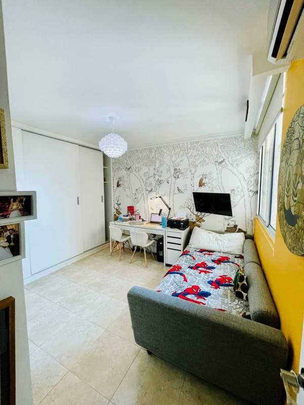 Bedroom in Pacific Point with marble floors, built-in closets, window city view