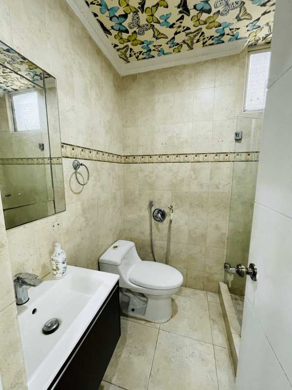 Elegant lobby with marble floors and chandelier in PH Pacific Point luxury tower Panama City