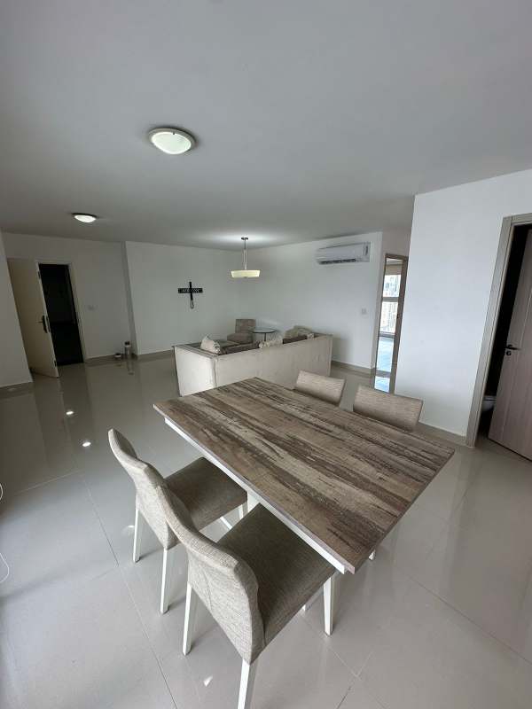Open kitchen with granite counters and appliances in PH Coco del Mar Panama City apartment