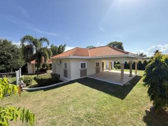 Exterior view Mediterranean architecture single level house with arches and garden Chitré Cantarrana Panama