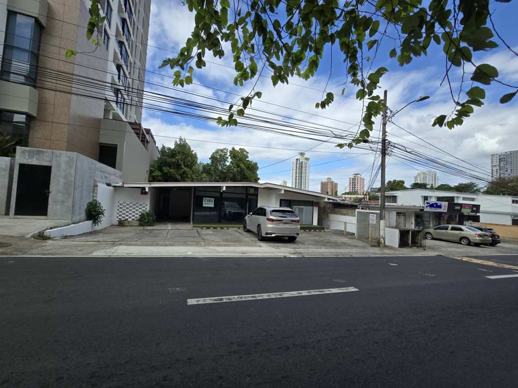View of commercial building with large windows and adjacent residential tower Panama City