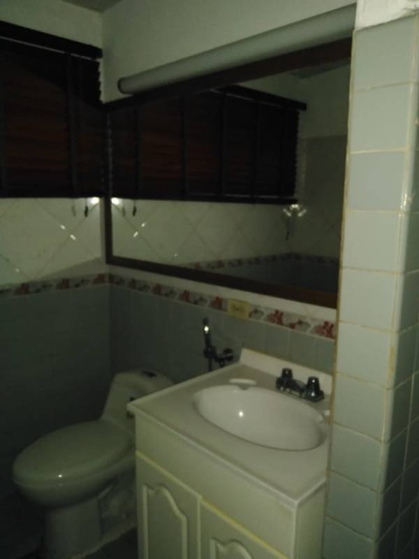 Bathroom with vanity sink and toilet in commercial building San Francisco Panama