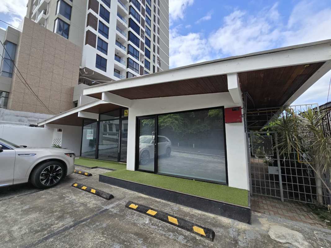 Modern glass storefront facade with parking lot for rent San Francisco Panama