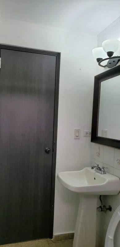 Updated bathroom with glass shower, pedestal sink, mirror in Parque Omar area San Francisco Panama