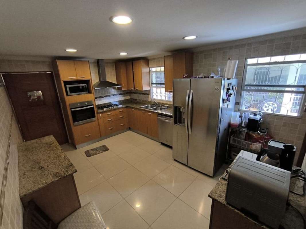 Upgraded kitchen with granite countertops, built-in stainless appliances in Chanis remodeled home Panama