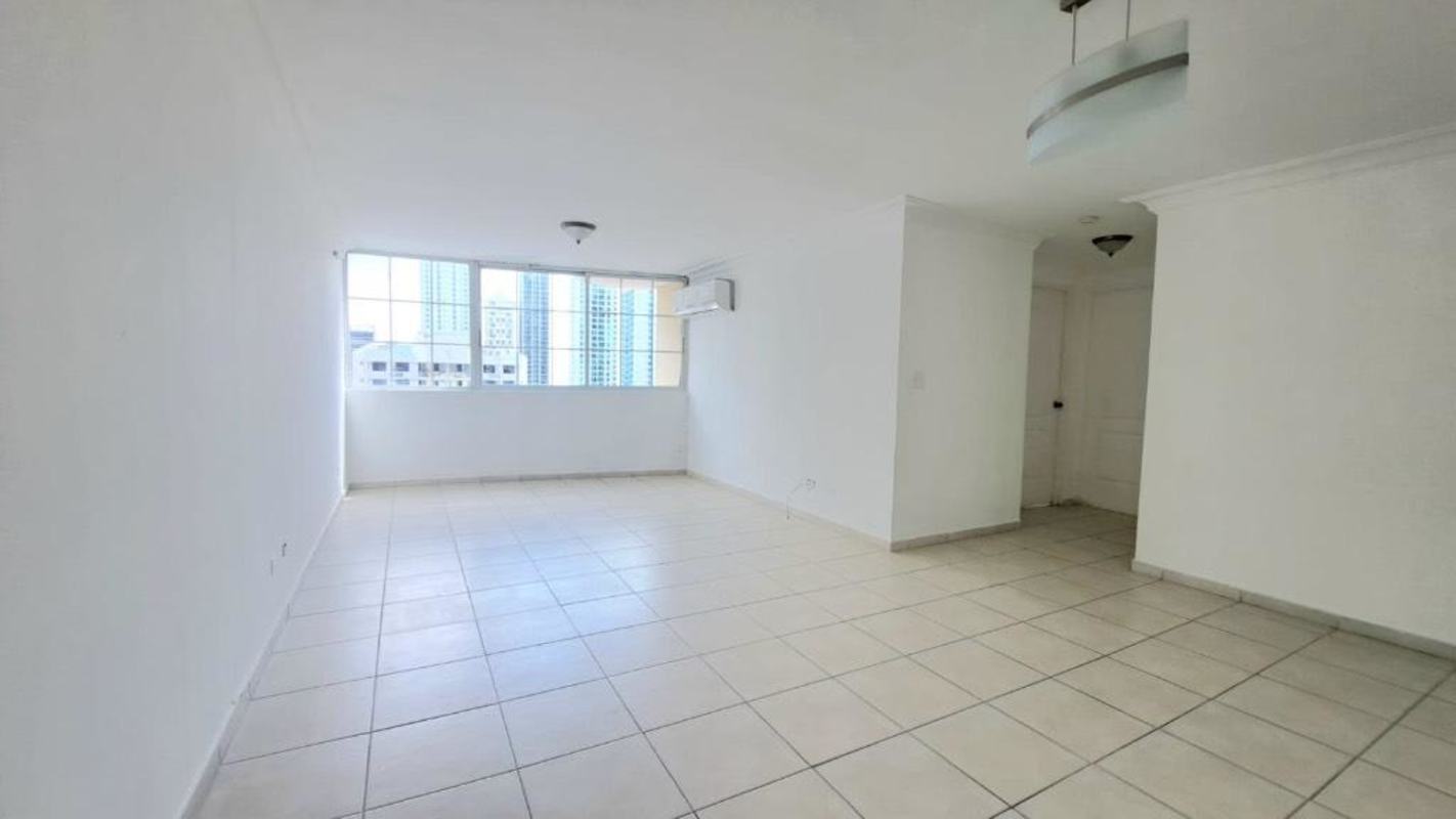Kitchen with granite countertops and wooden cabinets in PH Torres del Mar del Sur San Francisco Panama