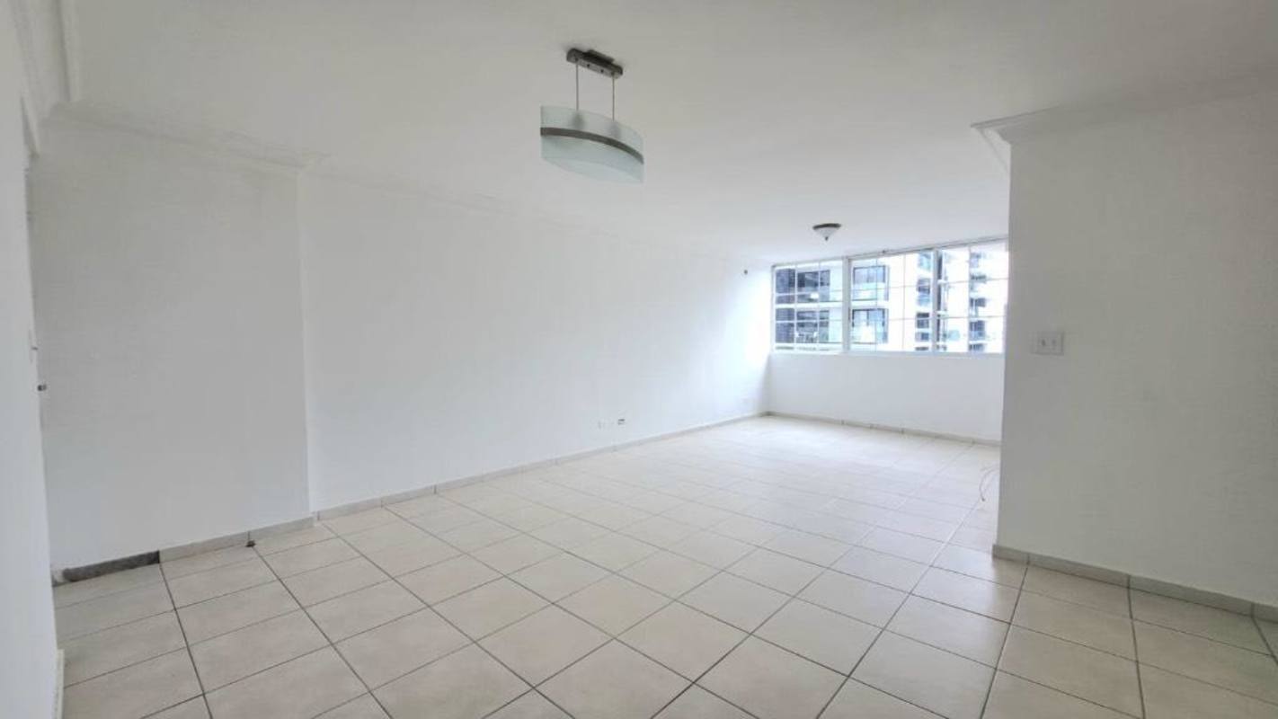 Bedroom with large window and city skyline view in PH Torres del Mar del Sur San Francisco Panama