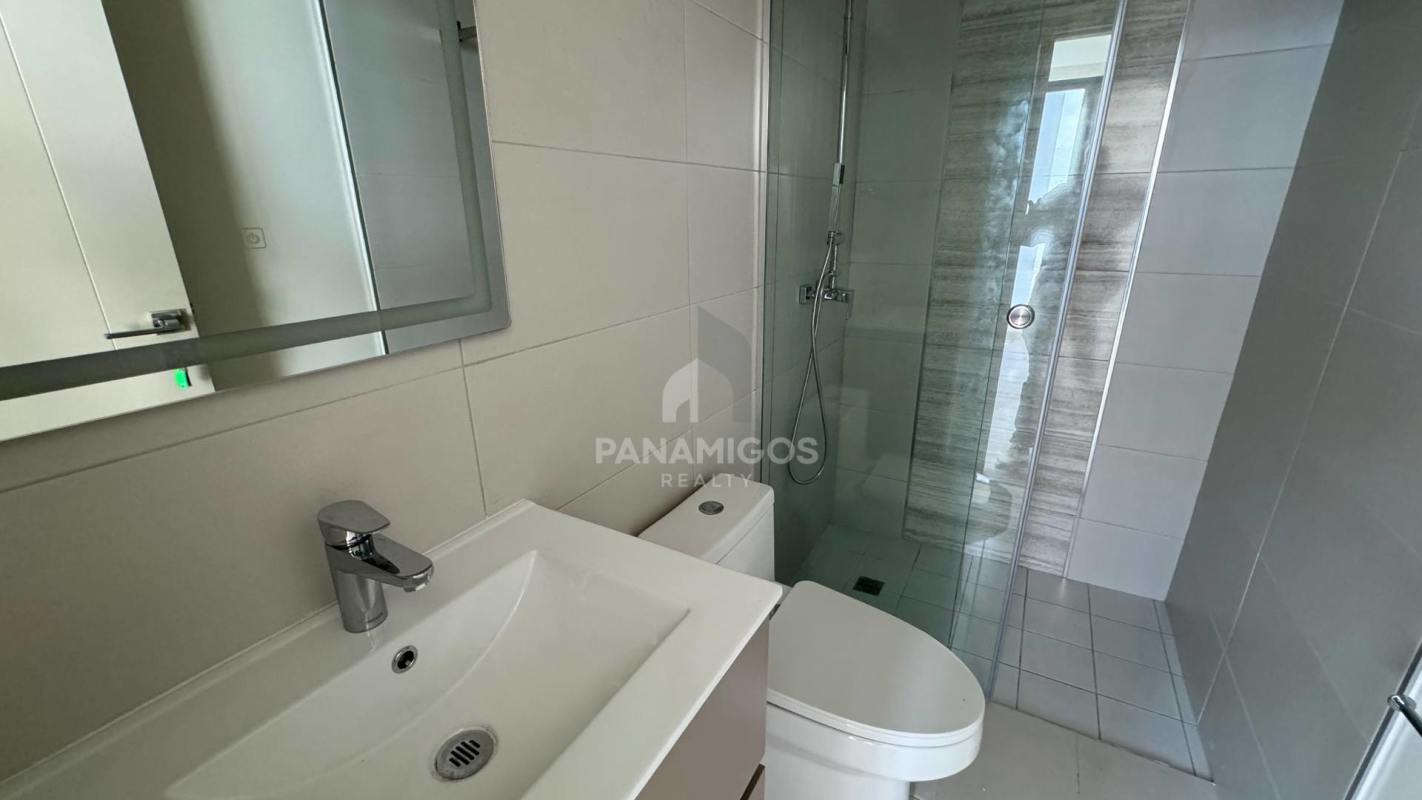 Minimalist living room with cityscape view and large window in PH Arcadia Costa del Este