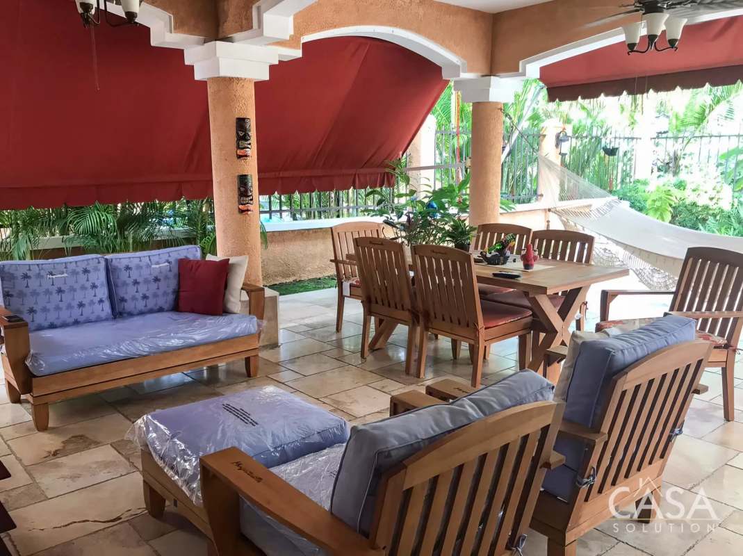 Covered patio with hammock, outdoor dining space, Mediterranean style Clayton Village Panama