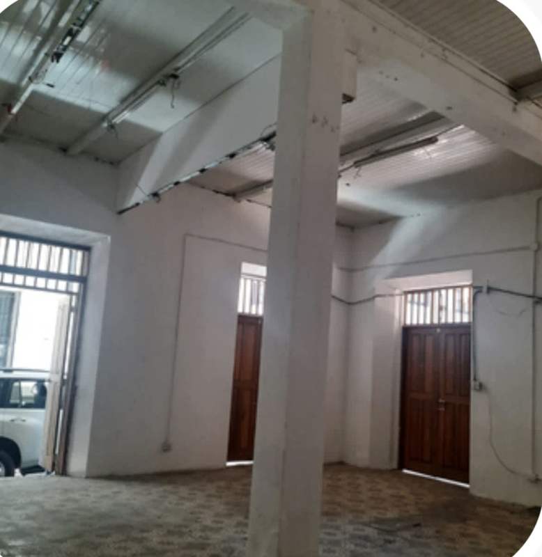 Large garage storage area high ceiling wooden doors commercial building Casco Viejo Panama