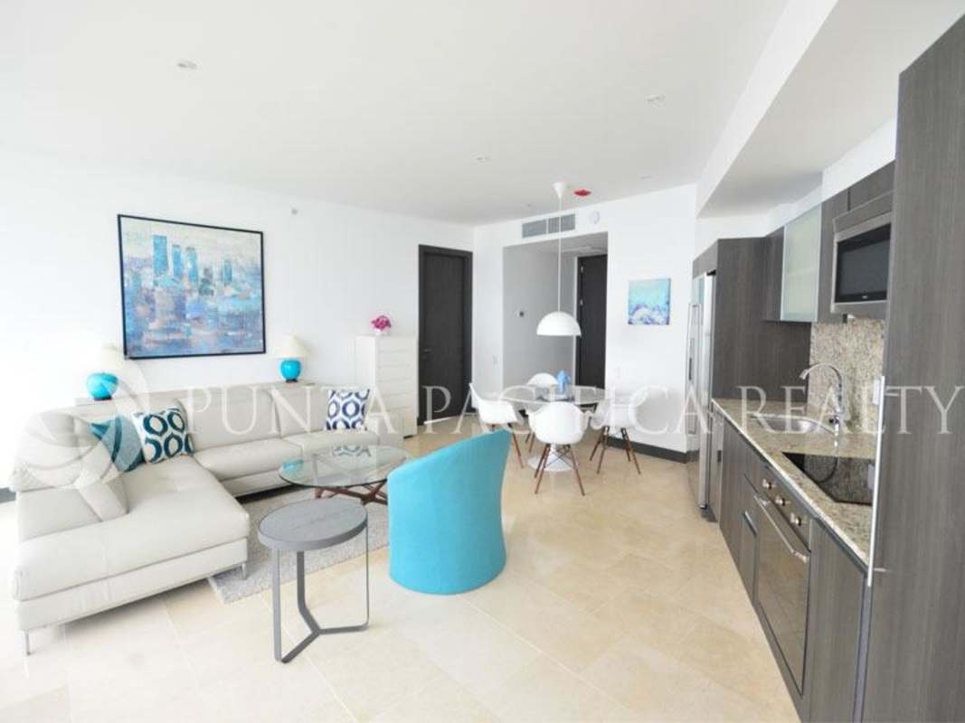 Bright modern open-concept living room with panoramic windows Punta Pacifica Panama