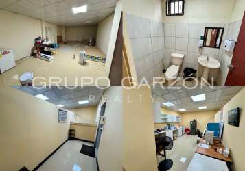 Bright commercial interiors with tiled floors large windows partitioned spaces for offices Arraiján Plaza Panama