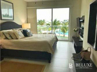 Guest bedroom in PH Bijao Residences with large windows and garden views